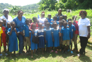 lady talking to children in a feeding event